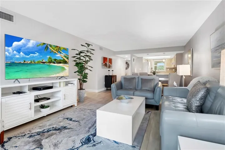 Living area with wood finished floors and baseboards