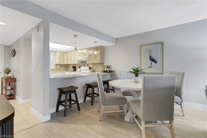 Dining space featuring baseboards and light wood-type flooring