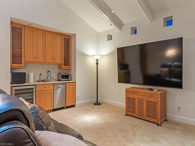 Multi-functional room - currently a spacious room with tv/den/bar