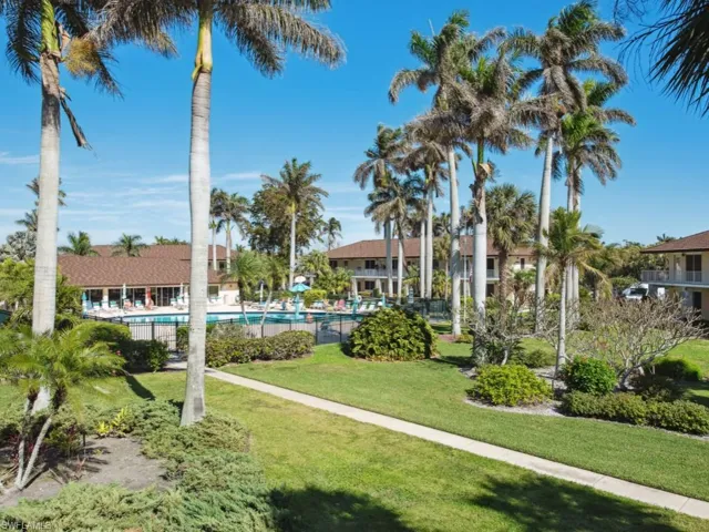 Surrounding community with a yard and a swimming pool