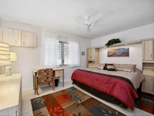 Tiled bedroom with ceiling fan