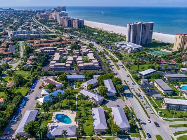 Aerial view with a water view and a view of the beach