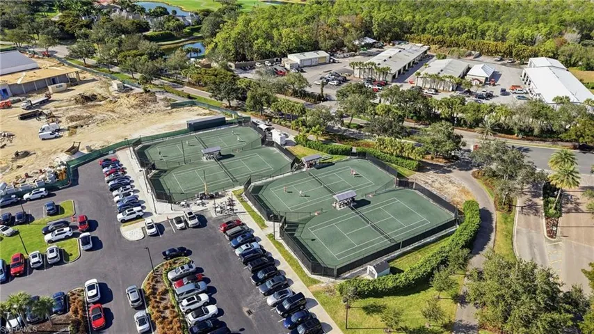 Aerial view of property's location with a large body of water