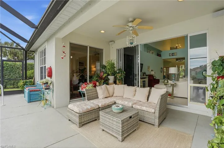 Covered patio with concrete flooring, recessed lighting, ceiling fan, and screened enclosure