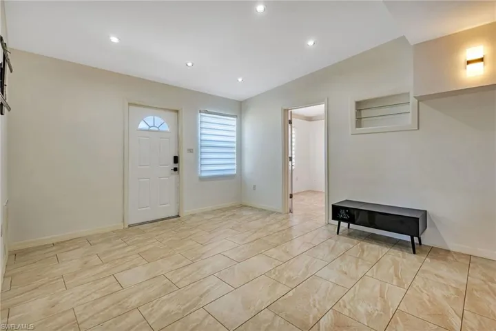 Foyer with light tile flooring