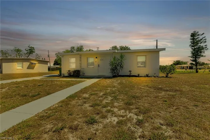 View of front of home with a yard