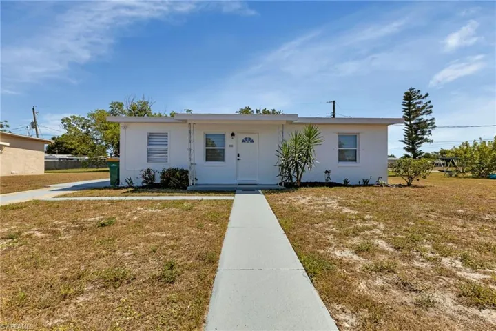 View of front of property with a front yard