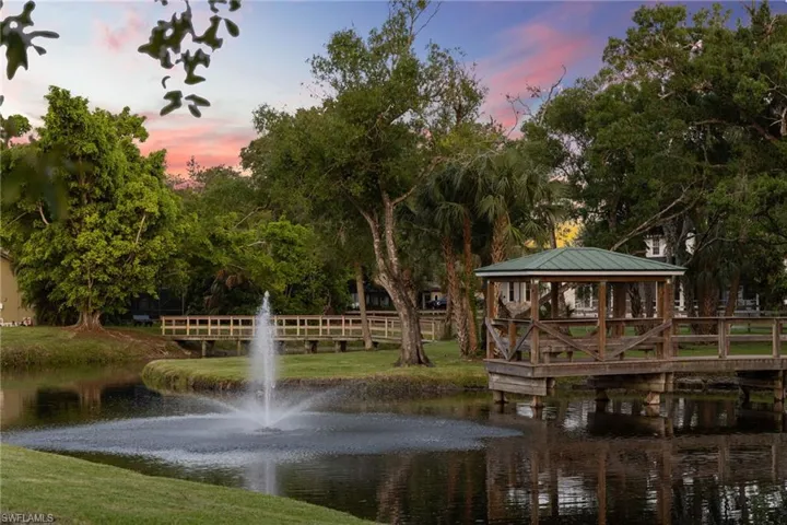 View of home's community with a water view and a gazebo