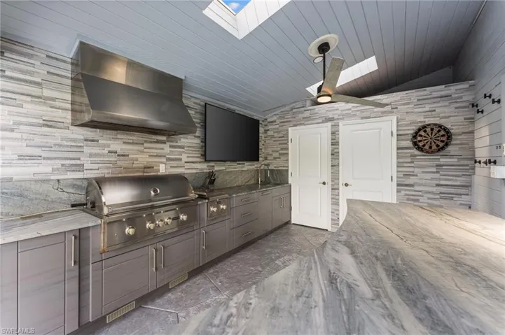 View of patio with an outdoor kitchen