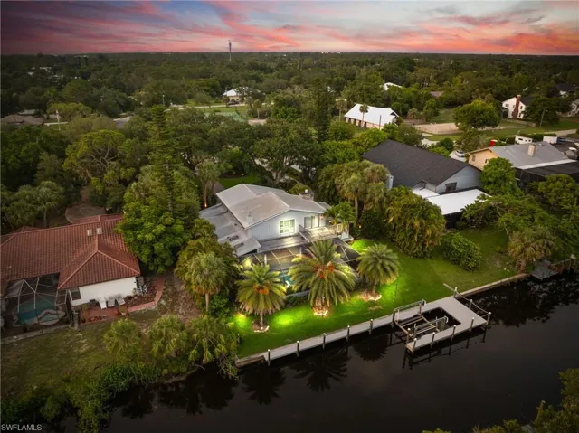Aerial view at dusk of a water view and a forest view
