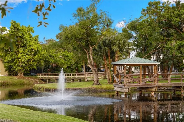 View of community with a water view and a gazebo