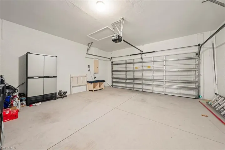 Garage featuring a garage door opener