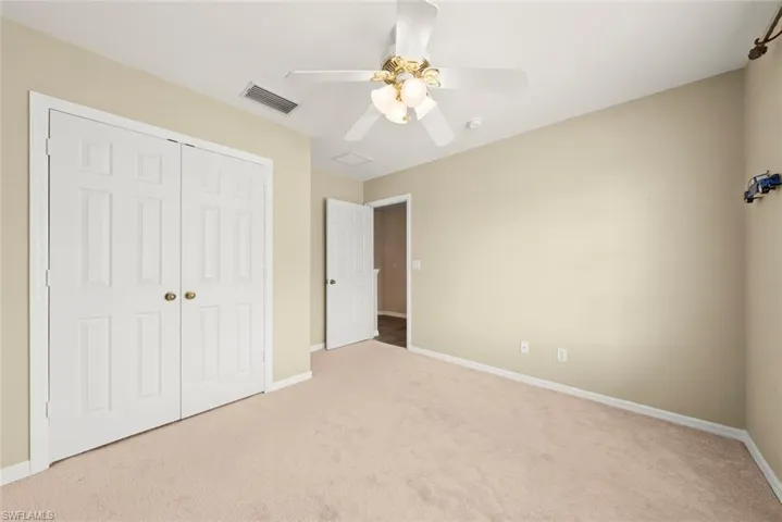 Unfurnished bedroom #3 featuring carpet and ceiling fan