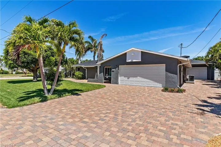 Home with Detached Garage located behind.