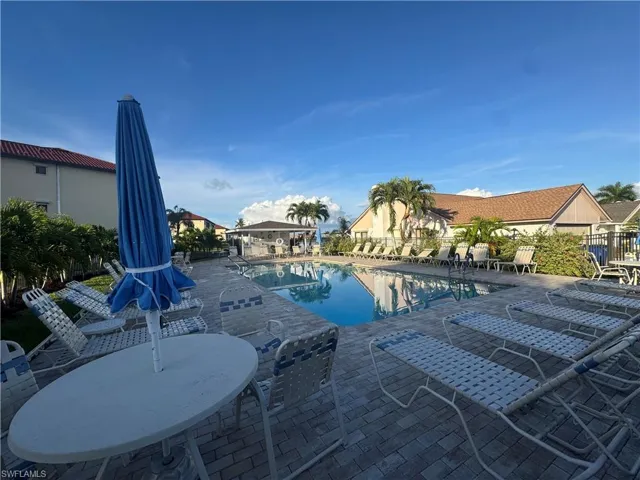 Community pool featuring a patio area