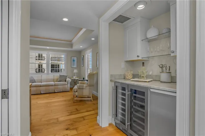 Wine Cooler and Clear Ice Machine Below Bar.
