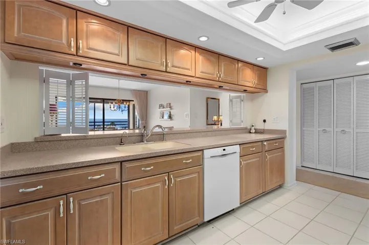 Kitchen featuring dishwasher, recessed lighting, ceiling fan, ornamental molding, and light tile patterned floors
