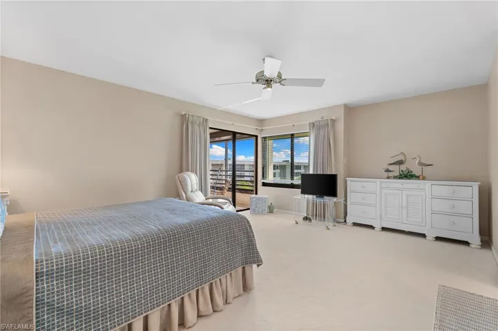 Bedroom featuring carpet flooring and a ceiling fan