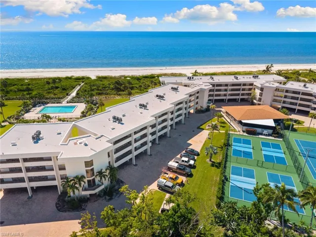Aerial view of apartment complex / building and unending shoreline
