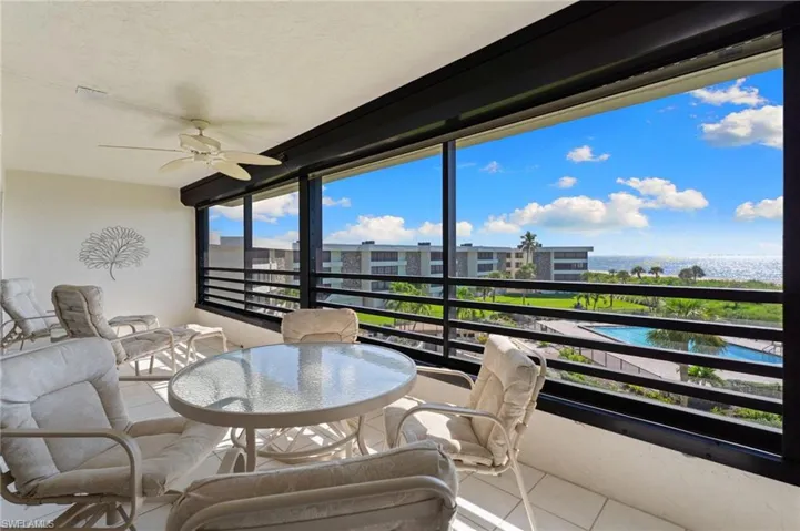 Sunroom / solarium featuring tile patterned flooring and a textured ceiling