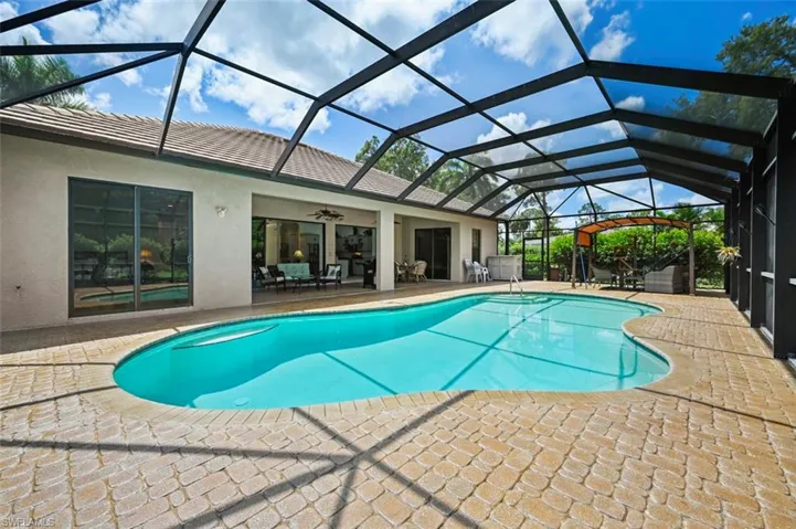Swimming pool with a patio and ceiling fan