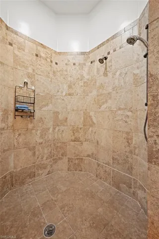 Full bathroom featuring tiled shower