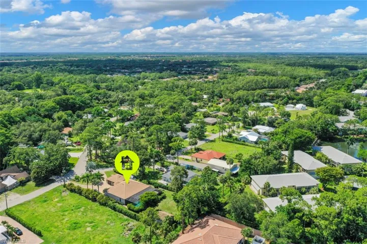 Aerial view of residential area with a forest