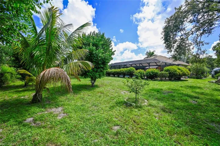 View of green lawn with a lanai
