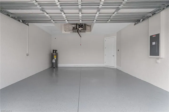Garage with electric panel and water heater