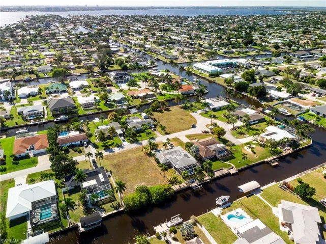 View of property location with nearby suburban area and a large body of water