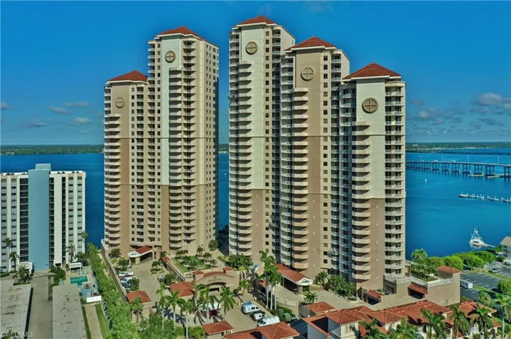 View of apartment building / complex with a water view