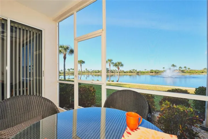 Sunroom with a water view