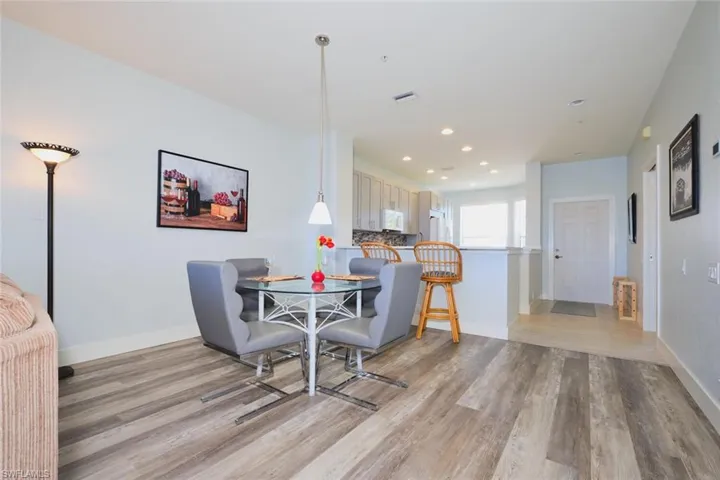 Dining space featuring recessed lighting and light wood finished floors