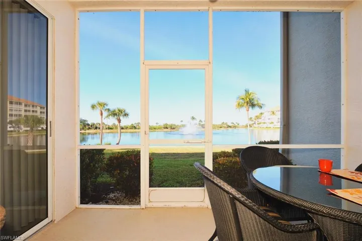Sunroom / solarium with a water view and plenty of natural light