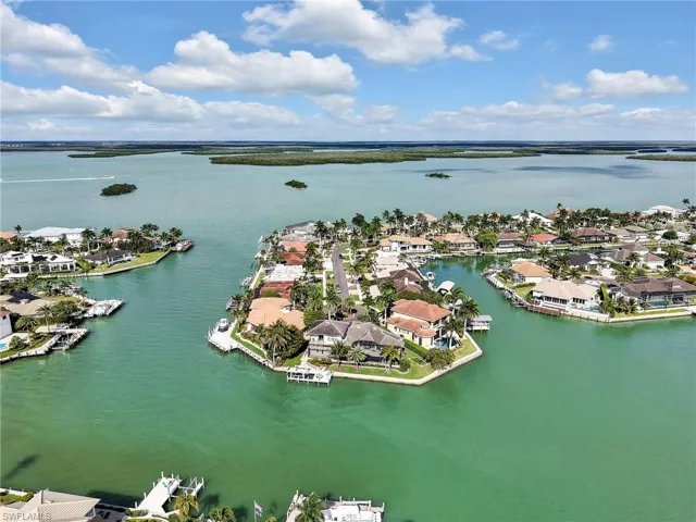 Aerial perspective of suburban area with a large body of water