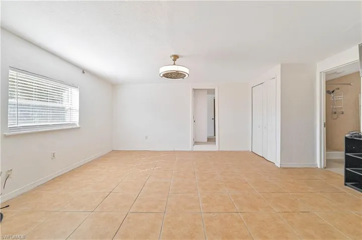Unfurnished room featuring light tile patterned flooring