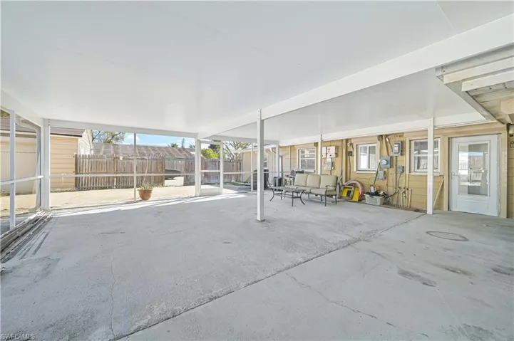 Fenced backyard with a patio