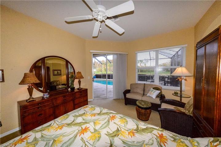 Primary bedroom with pool view