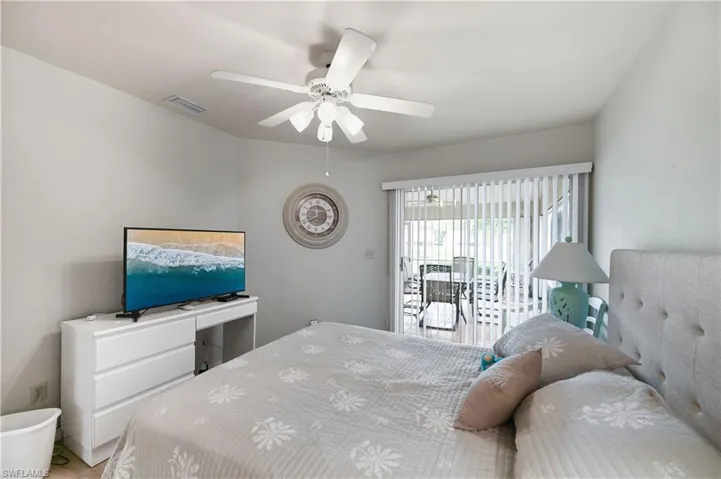 3rd Bedroom featuring access to outside and ceiling fan