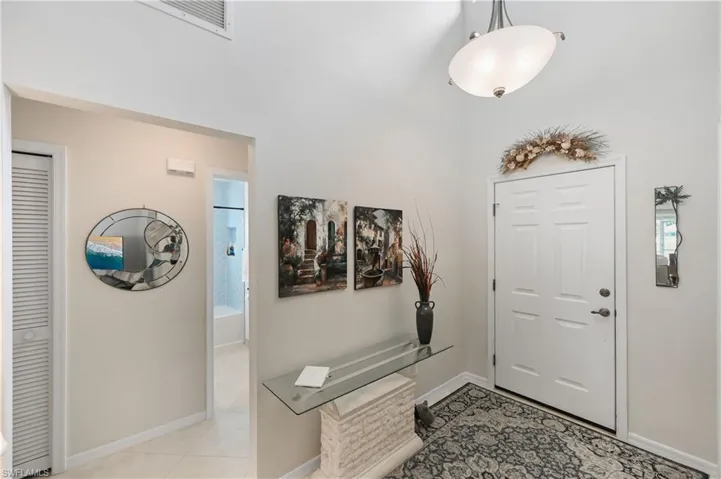 Tiled foyer entrance with close proximity to front of house placement for bedroom 2, 2nd bathroom, and bedroom 3.