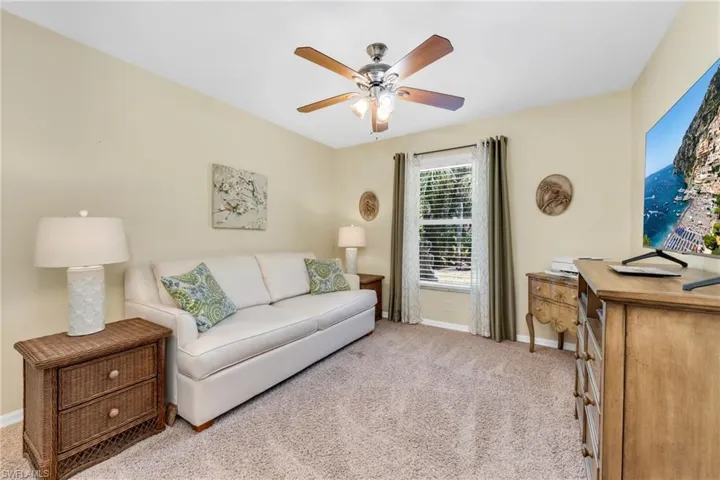 Bright and versatile guest bedroom with neutral tones.