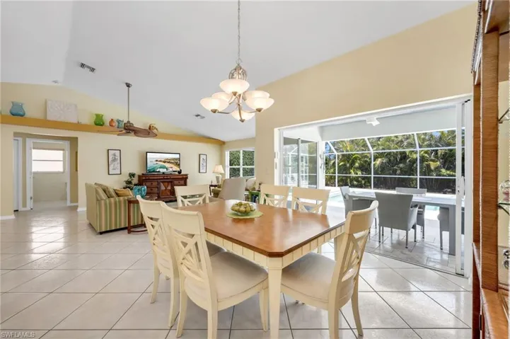 Perfectly situated near the kitchen, this dining space is flooded with sunlight and outdoor views.