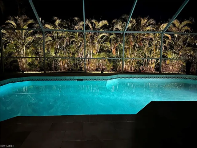 Stunning evening ambiance — enjoy a beautifully lit poolside retreat under the stars.