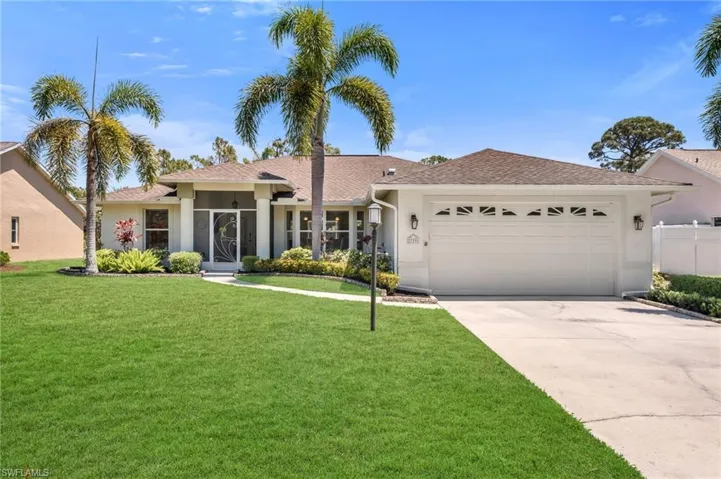 Manicured lawn and inviting entrance set the tone for this stunning home.