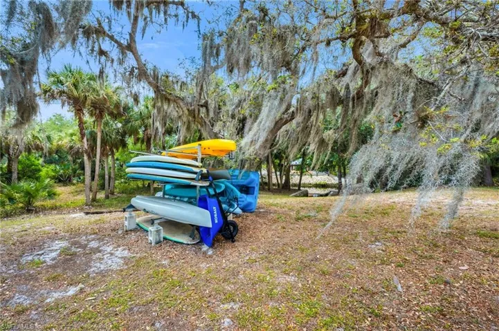 Adventure awaits — community kayak launch nestled among serene oaks and Spanish moss.