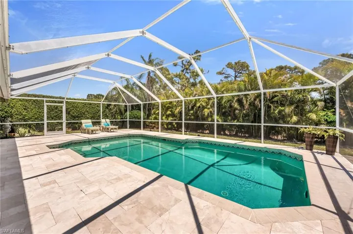 Soak up the sun or take a dip—this private, screened pool area is your personal paradise.
