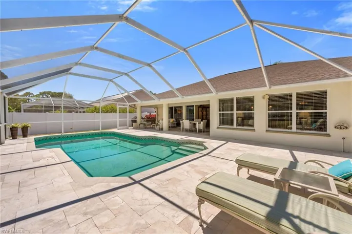 Spacious patio and pool deck ideal for entertaining, lounging, or dining alfresco.