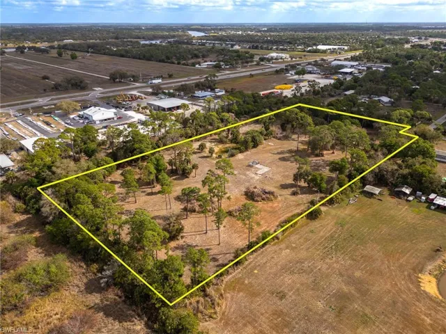Aerial view of sparsely populated area with property boundaries highlighted