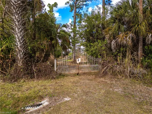 View of yard with a gate