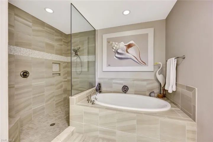 Bathroom featuring separate shower and tub